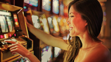 woman playing slot machine