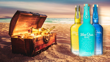 treasure chest on the beach with 3 bottles of rum