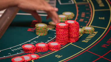 placing chips on a baccarat table